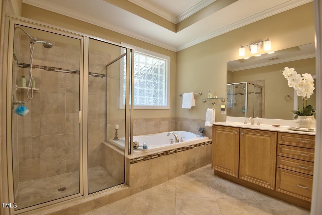 2919 Reynolda Circle Durham, NC 27712 - Photo 45 of 58 a spacious bathroom with a tub sink shower and mirror