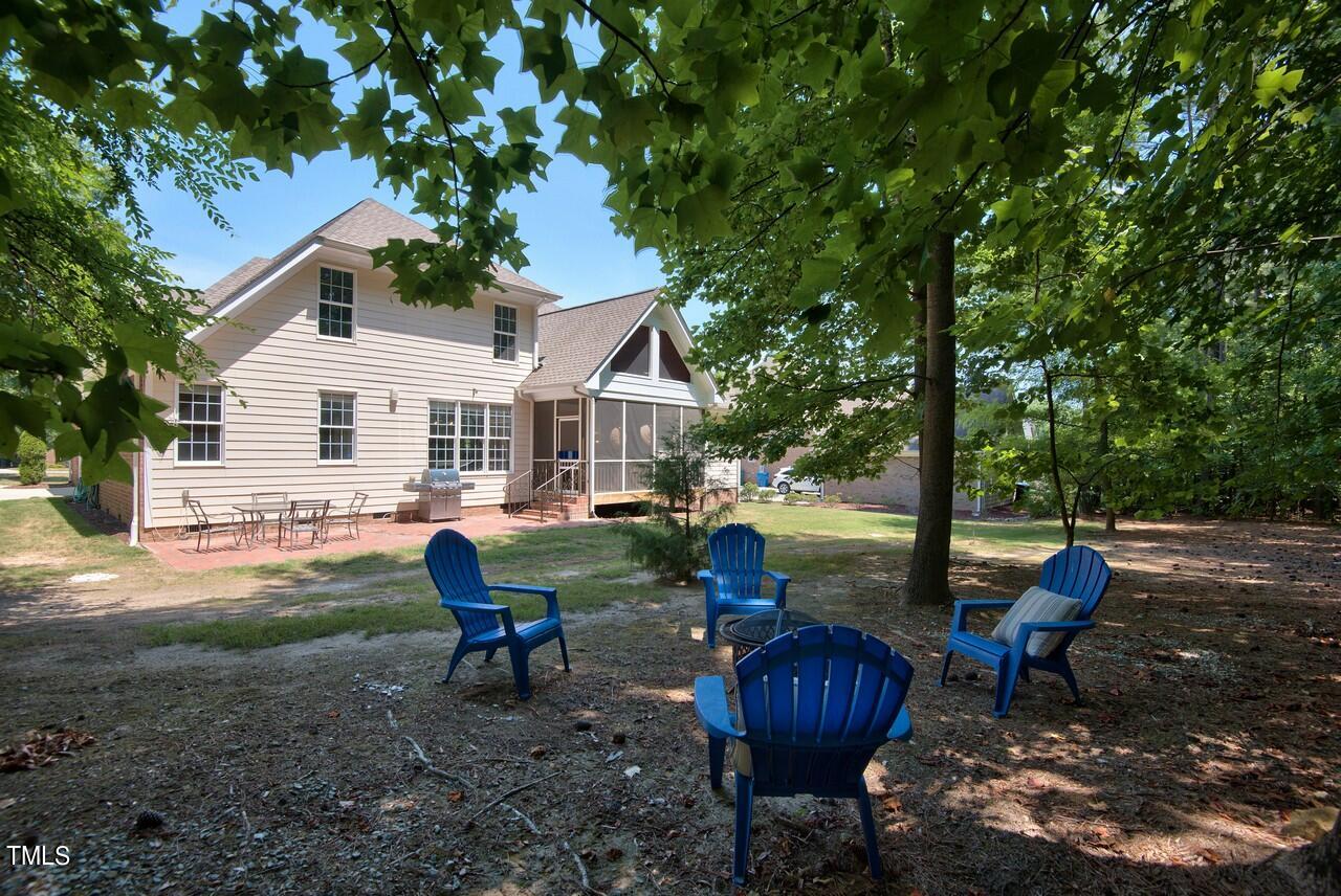 2919 Reynolda Circle Durham, NC 27712 - Photo 6 of 58 a front view of a house with garden and sitting area