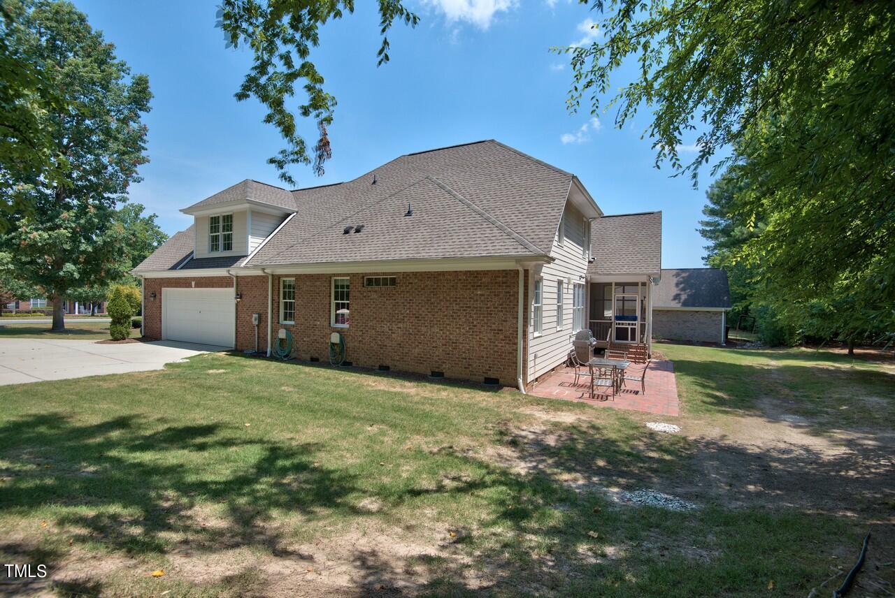 2919 Reynolda Circle Durham, NC 27712 - Photo 9 of 58 a front view of a house with a yard and garage