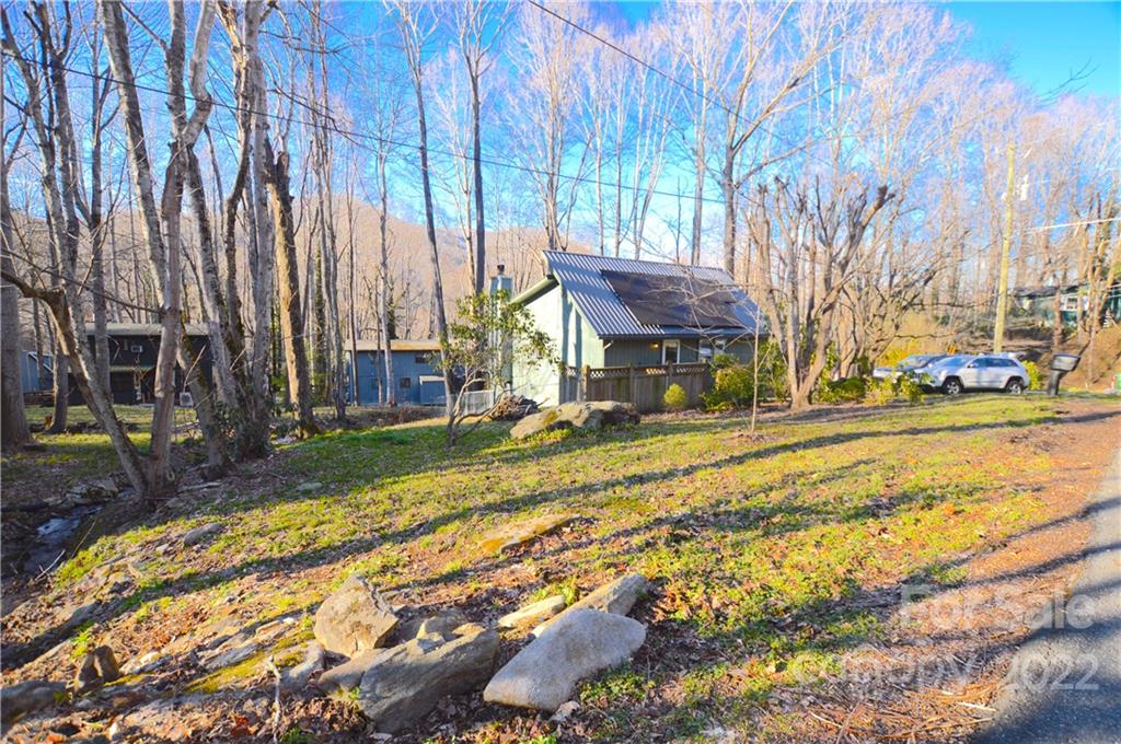 4 Blue Jay Loop Maggie Valley, NC 28751 - Photo 14 of 46 a view of a house with a yard covered with snow in the outdoor