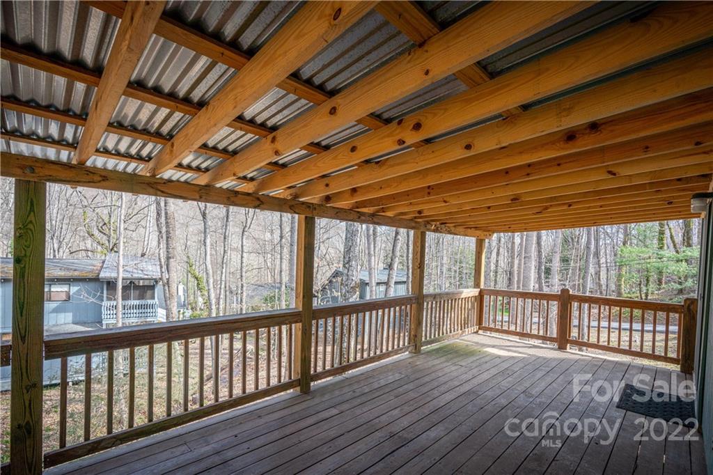 4 Blue Jay Loop Maggie Valley, NC 28751 - Photo 4 of 46 a view of a porch with wooden floor