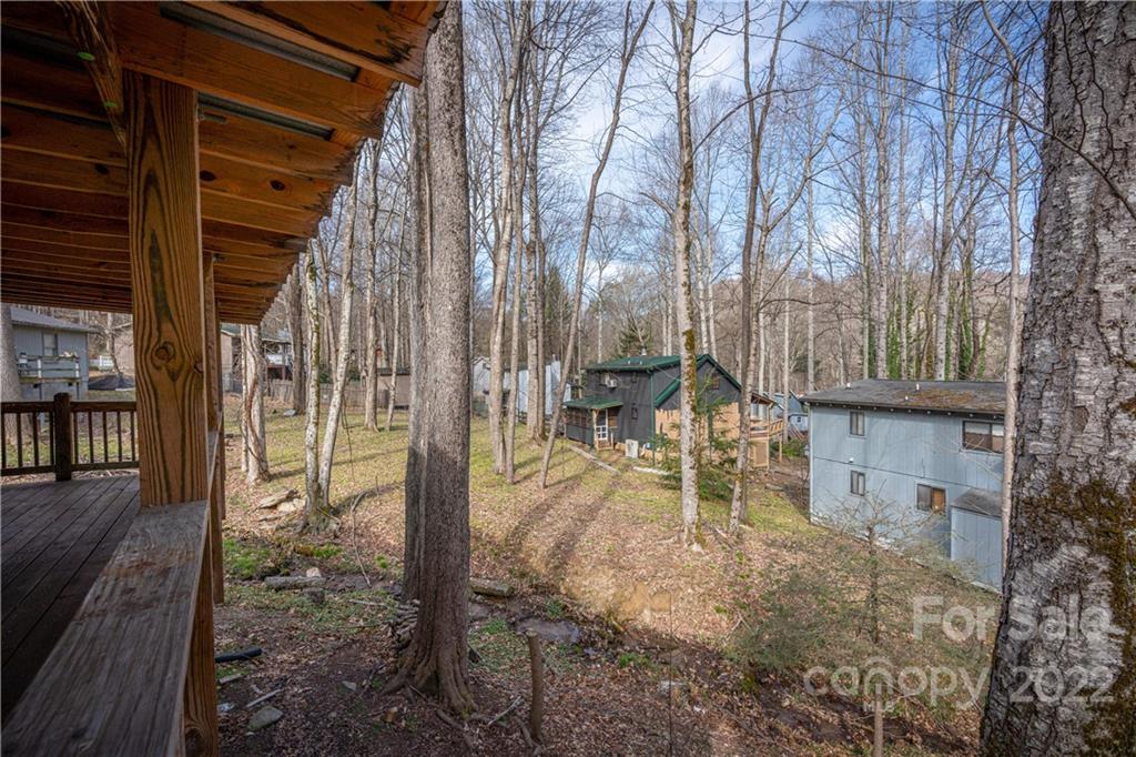 4 Blue Jay Loop Maggie Valley, NC 28751 - Photo 42 of 46 a backyard of a house with table and chairs