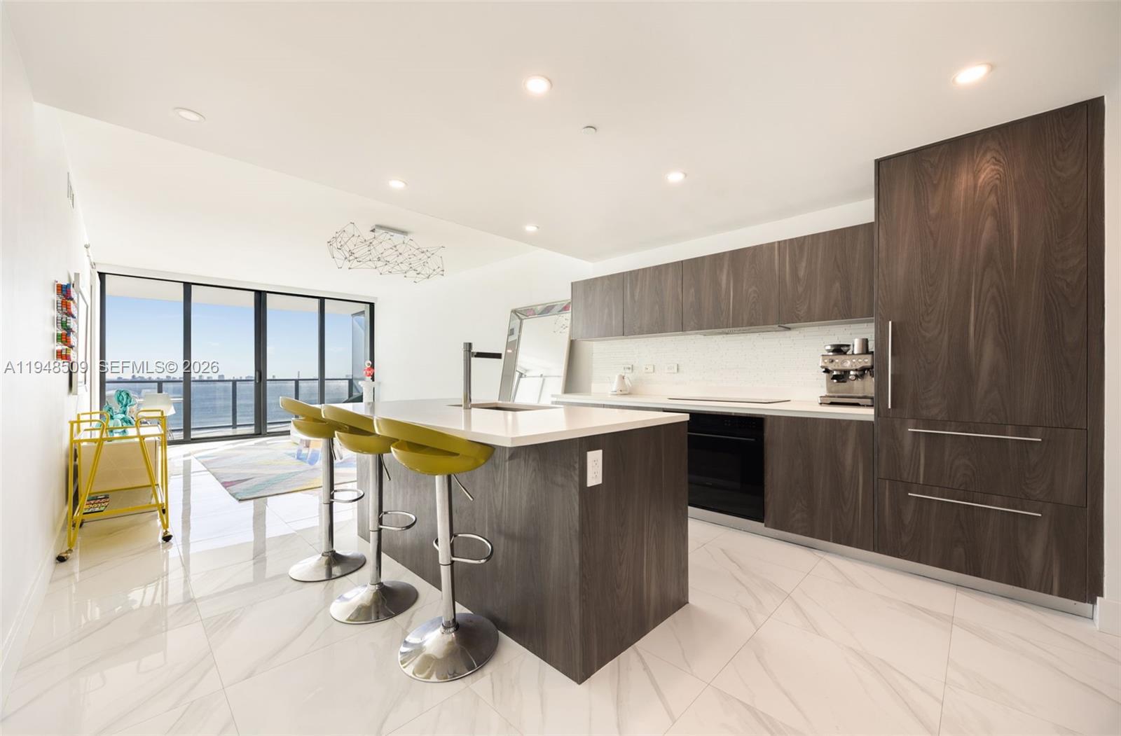 3131 Northeast 7th Avenue, Unit 1902 Miami, FL 33137 - Photo 5 of 15 a kitchen with a sink cabinets and counter top space