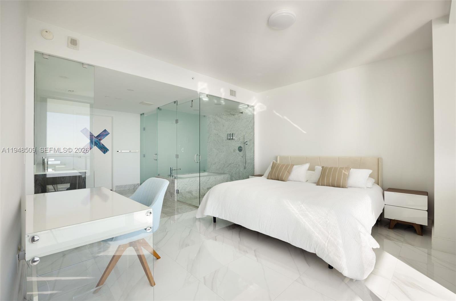 3131 Northeast 7th Avenue, Unit 1902 Miami, FL 33137 - Photo 10 of 15 a bedroom with a bed and a table