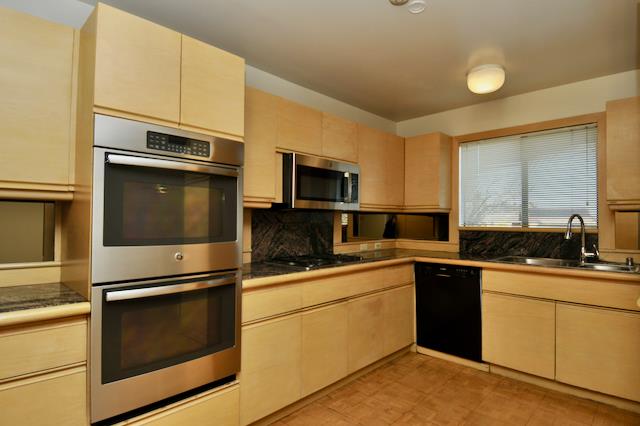 Undisclosed Address Millbrae, CA 94030 - Photo 19 of 30 a kitchen with granite countertop a sink stainless steel appliances and cabinets