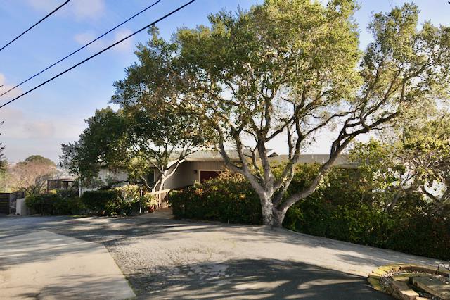 Undisclosed Address Millbrae, CA 94030 - Photo 2 of 30 a front view of a house with a yard