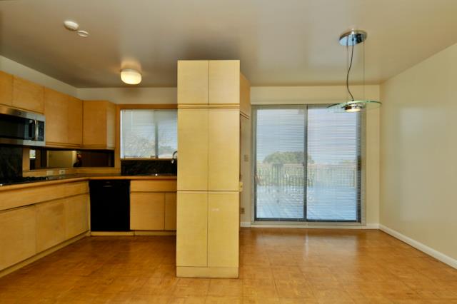 Undisclosed Address Millbrae, CA 94030 - Photo 21 of 30 a kitchen with a refrigerator a stove top oven and a ceiling fan