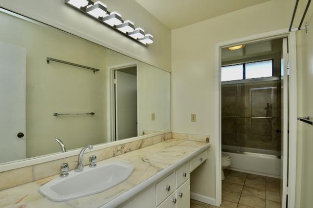 Undisclosed Address Millbrae, CA 94030 - Photo 24 of 30 a bathroom with a granite countertop sink a large mirror and a shower