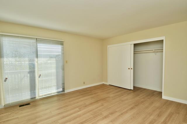 Undisclosed Address Millbrae, CA 94030 - Photo 26 of 30 an empty room with wooden floor and closet area