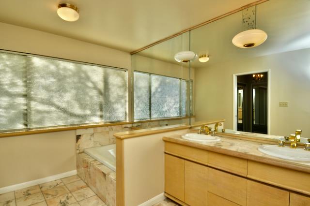 Undisclosed Address Millbrae, CA 94030 - Photo 8 of 30 a bathroom with a granite countertop sink and a large mirror