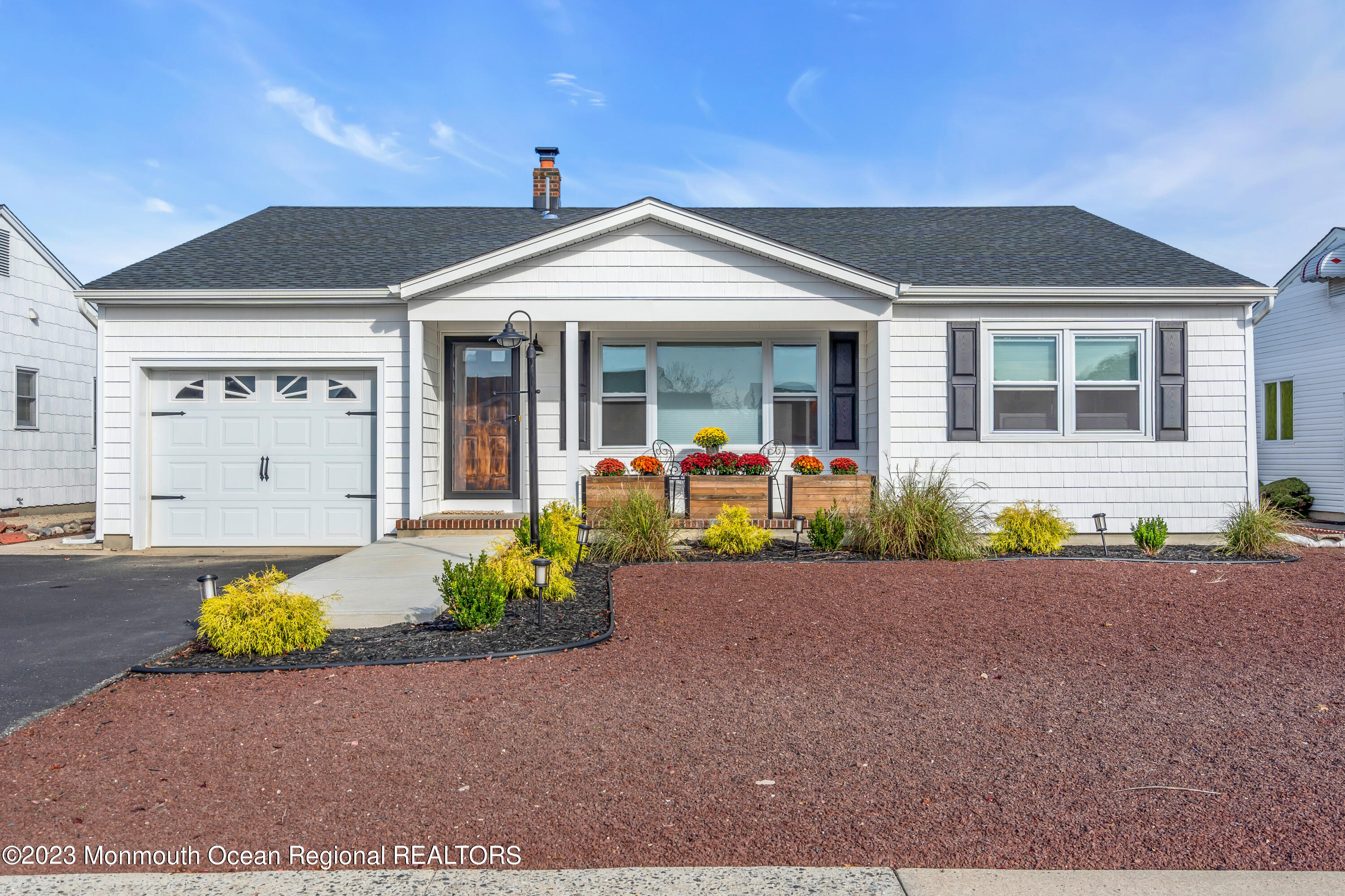 11 Garrett Road Toms River, NJ 08757 - Photo 1 of 61 a front view of a house with garden