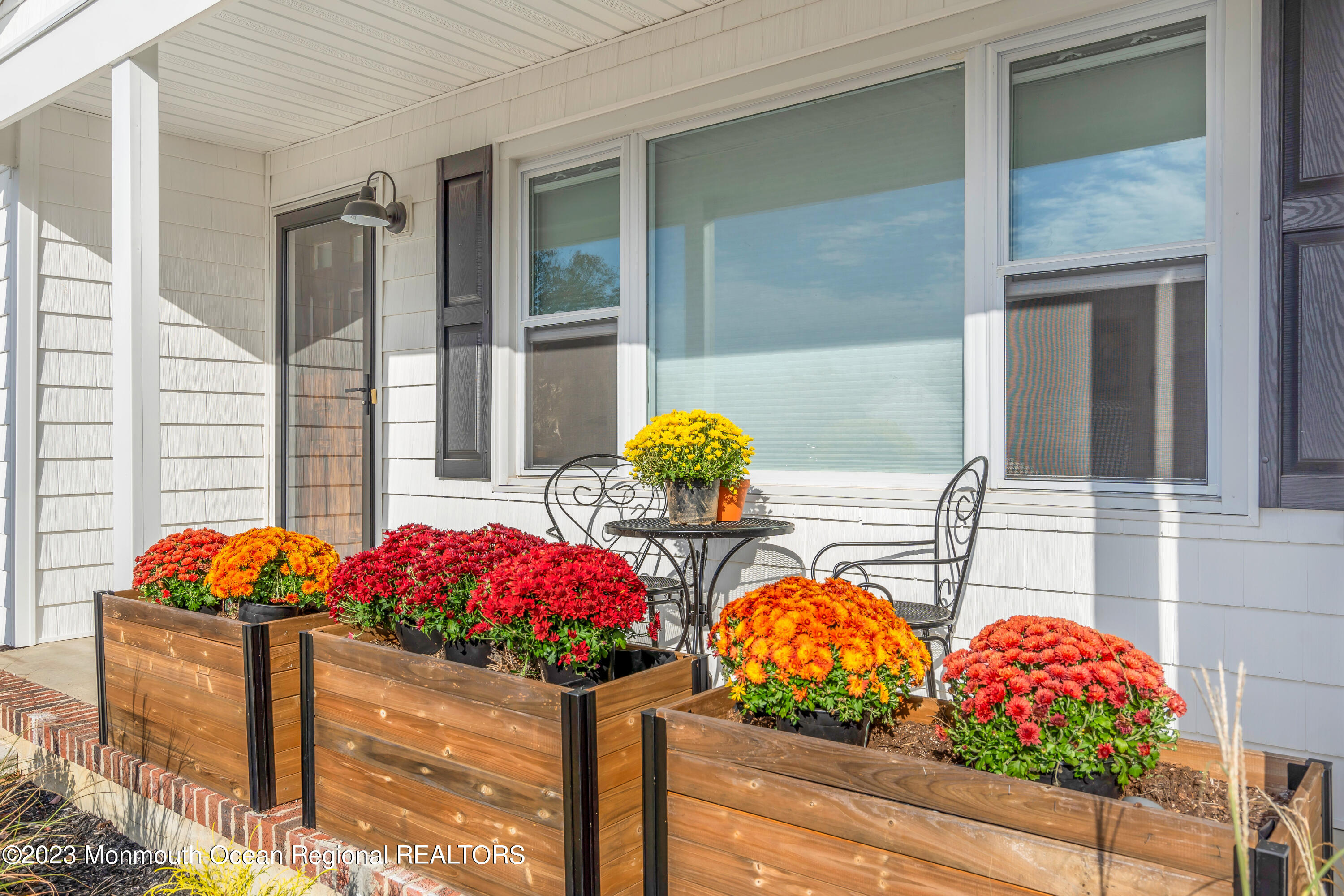 11 Garrett Road Toms River, NJ 08757 - Photo 11 of 61 a vase of flowers sitting on a table in front of a house