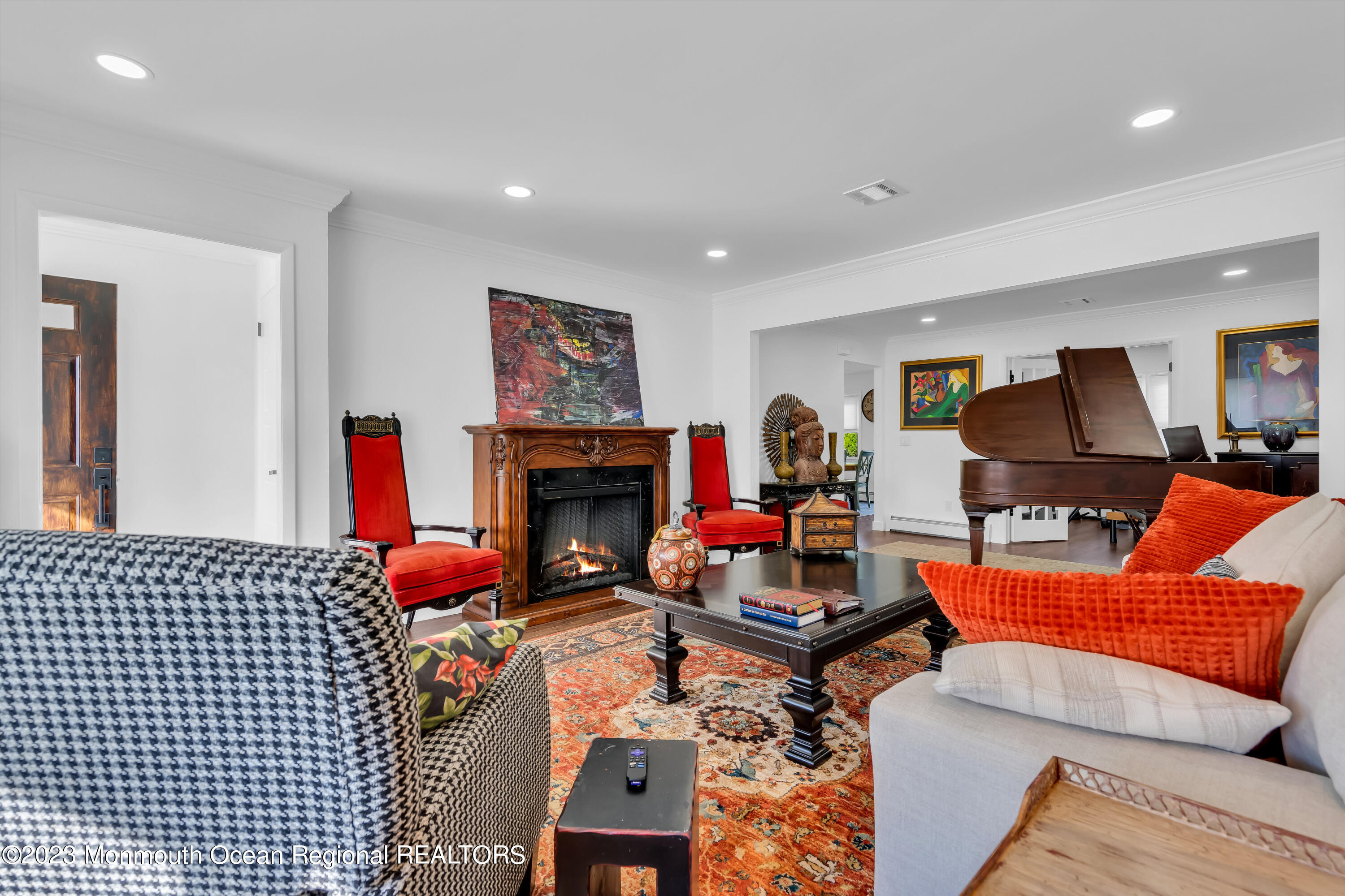 11 Garrett Road Toms River, NJ 08757 - Photo 16 of 61 a living room with furniture a fireplace and a flat screen tv