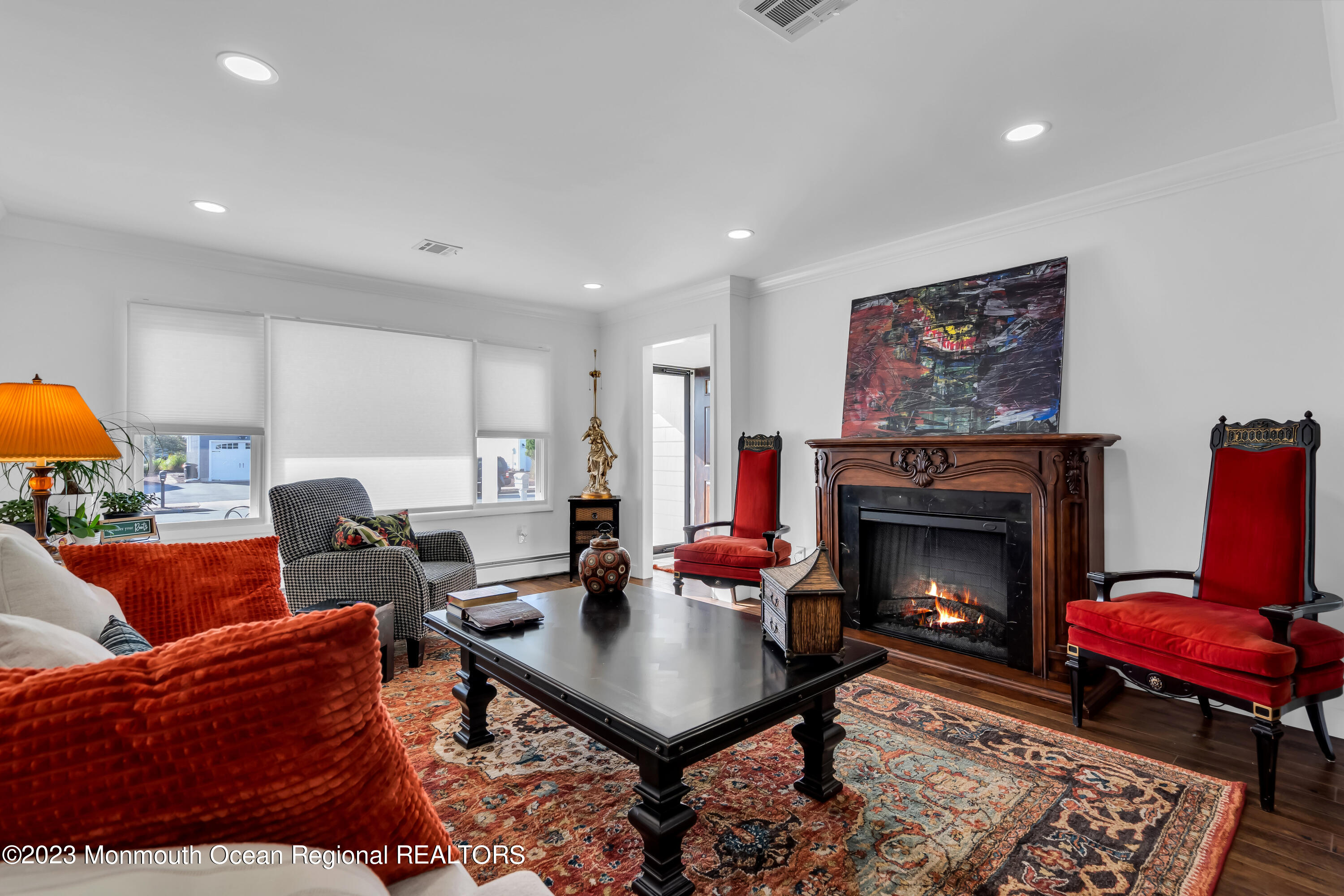 11 Garrett Road Toms River, NJ 08757 - Photo 19 of 61 a living room with furniture a rug and a fireplace