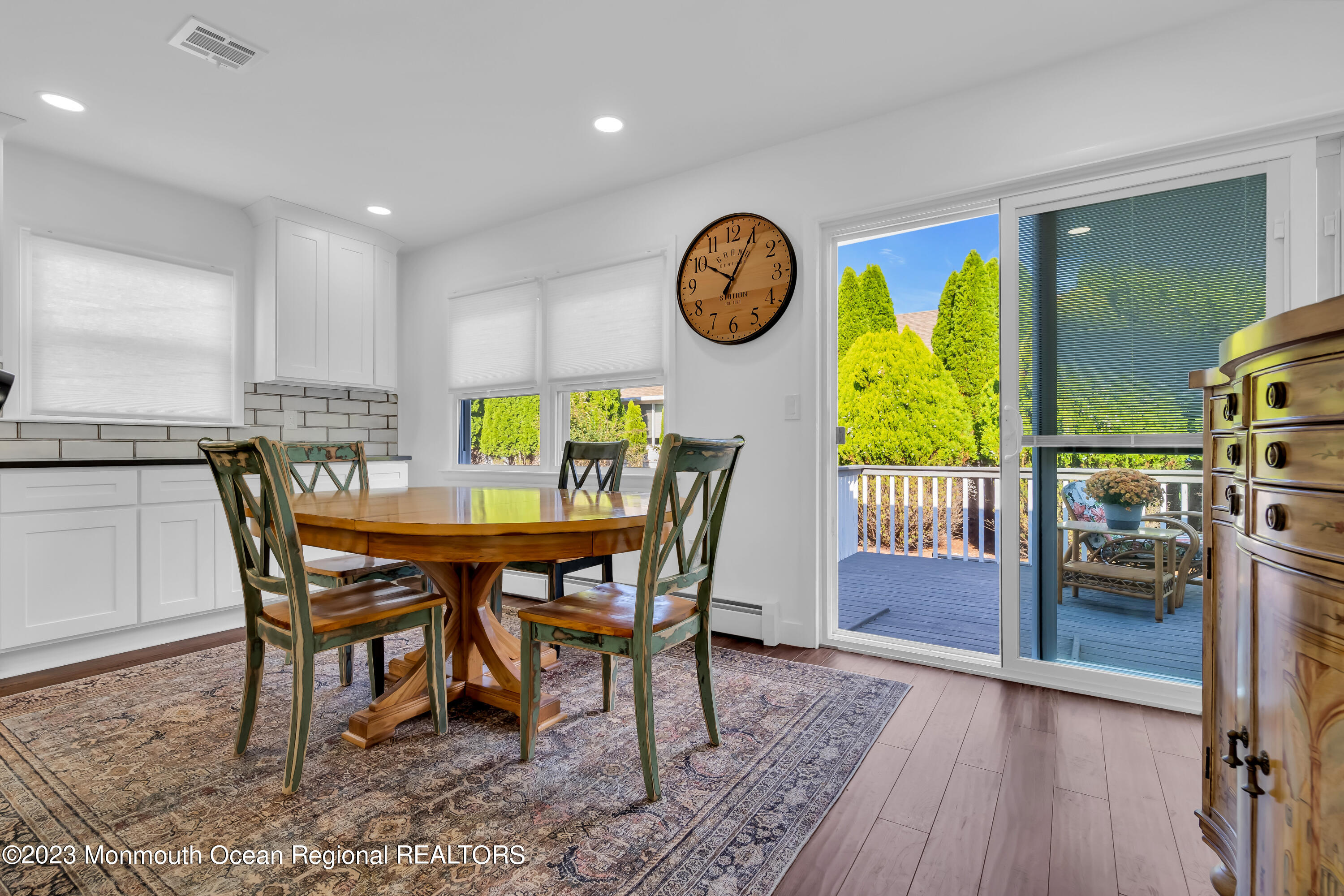 11 Garrett Road Toms River, NJ 08757 - Photo 26 of 61 a dining room with furniture and a clock
