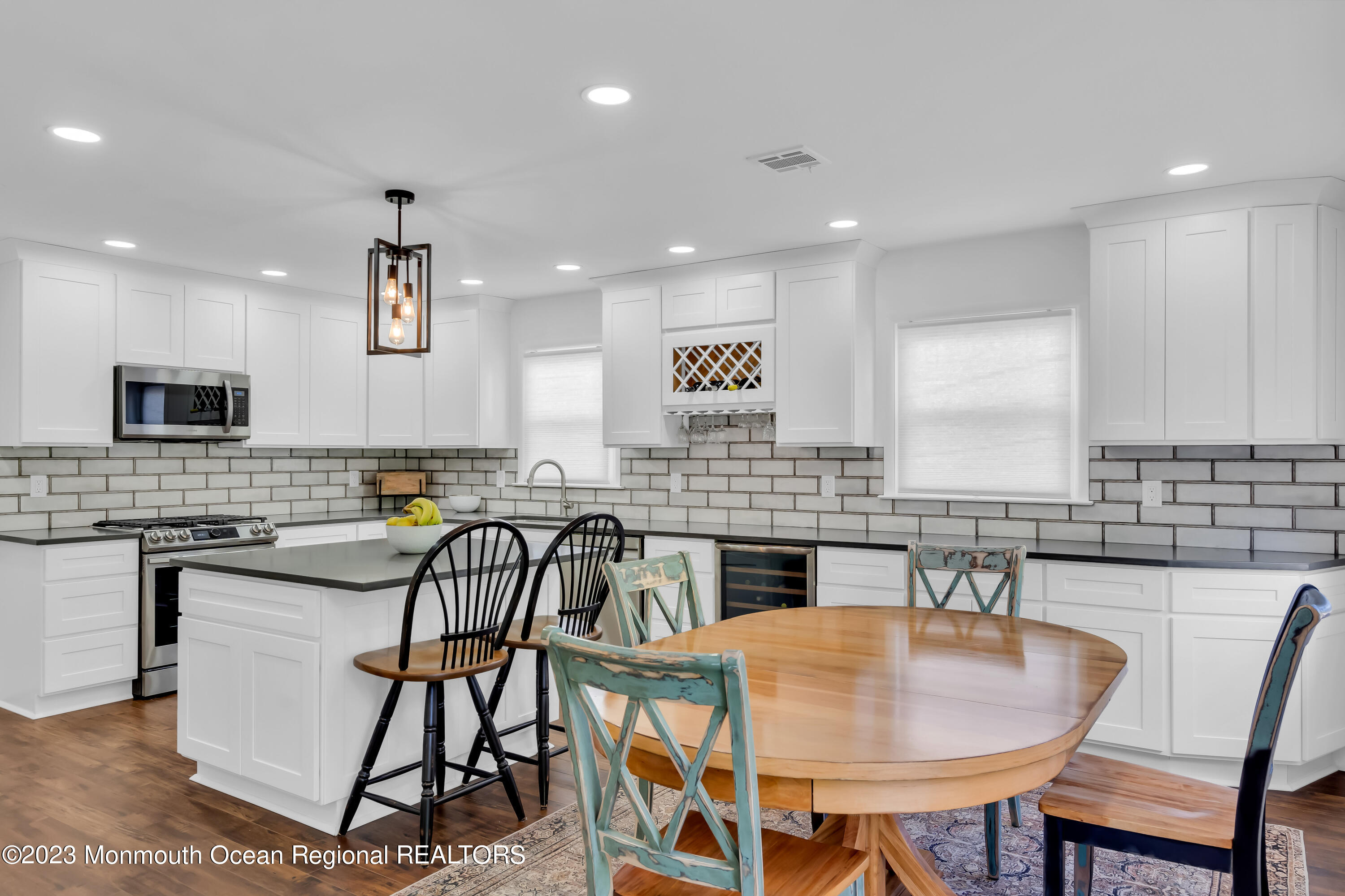 11 Garrett Road Toms River, NJ 08757 - Photo 28 of 61 a kitchen with a table chairs sink and cabinets