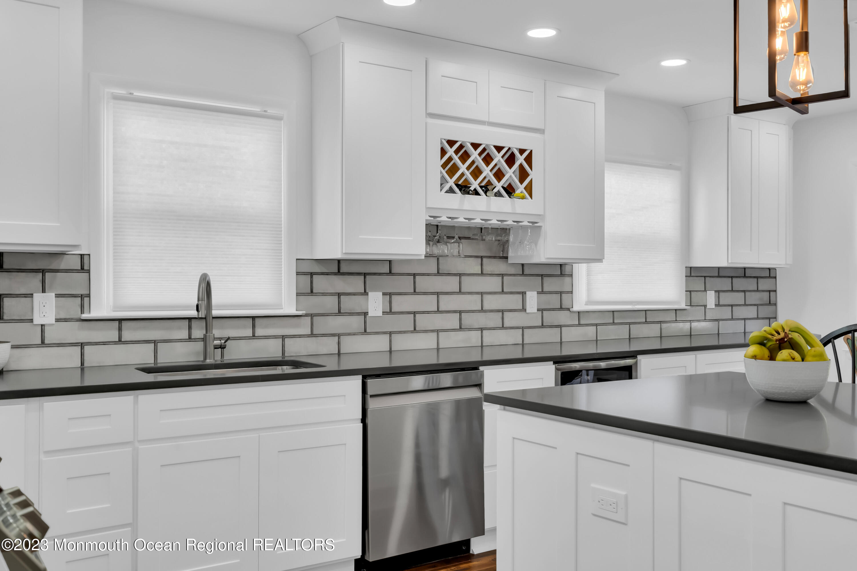 11 Garrett Road Toms River, NJ 08757 - Photo 35 of 61 a kitchen with stainless steel appliances white cabinets a sink and a window