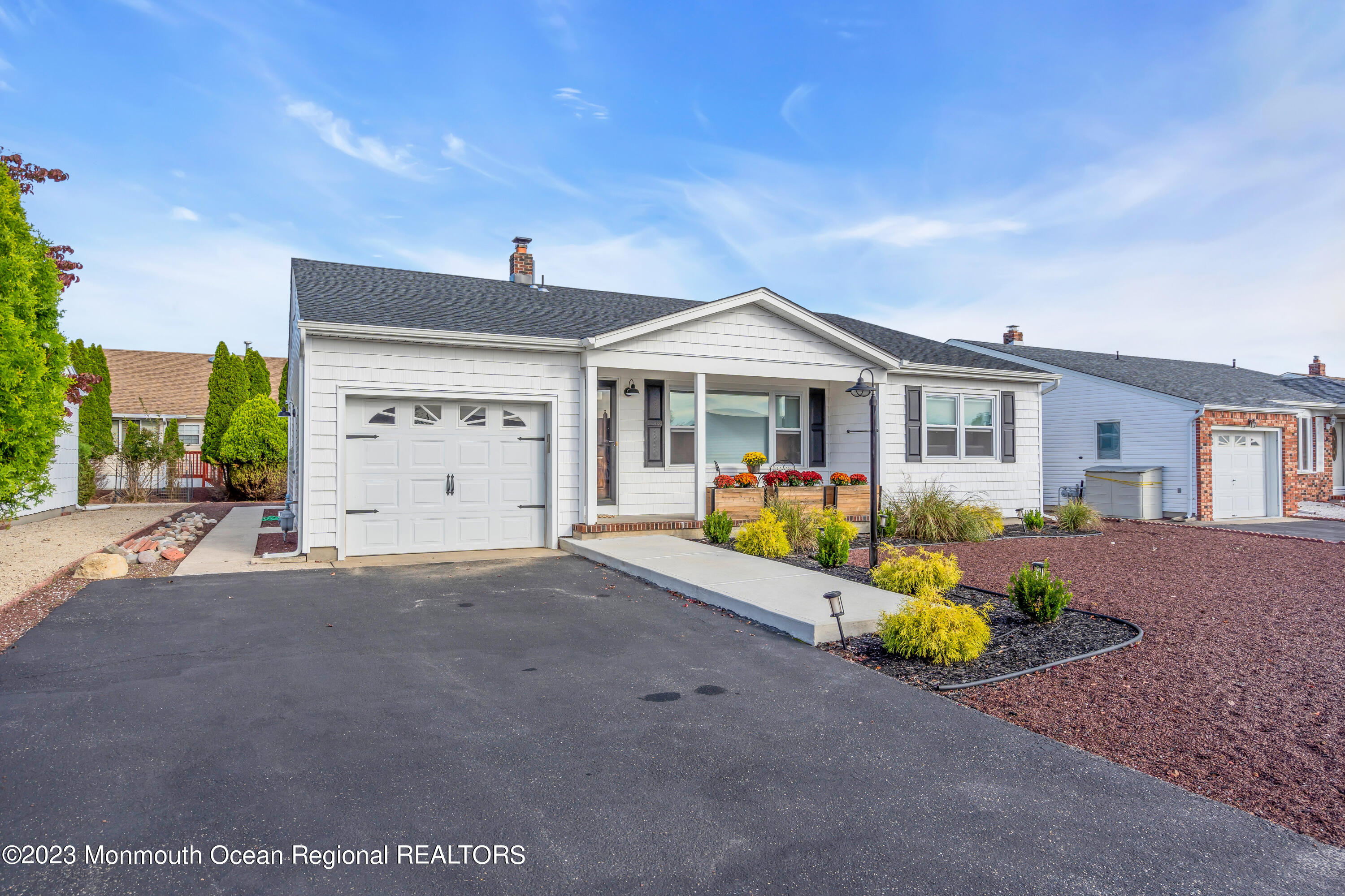 11 Garrett Road Toms River, NJ 08757 - Photo 4 of 61 a front view of a house with a yard and garage