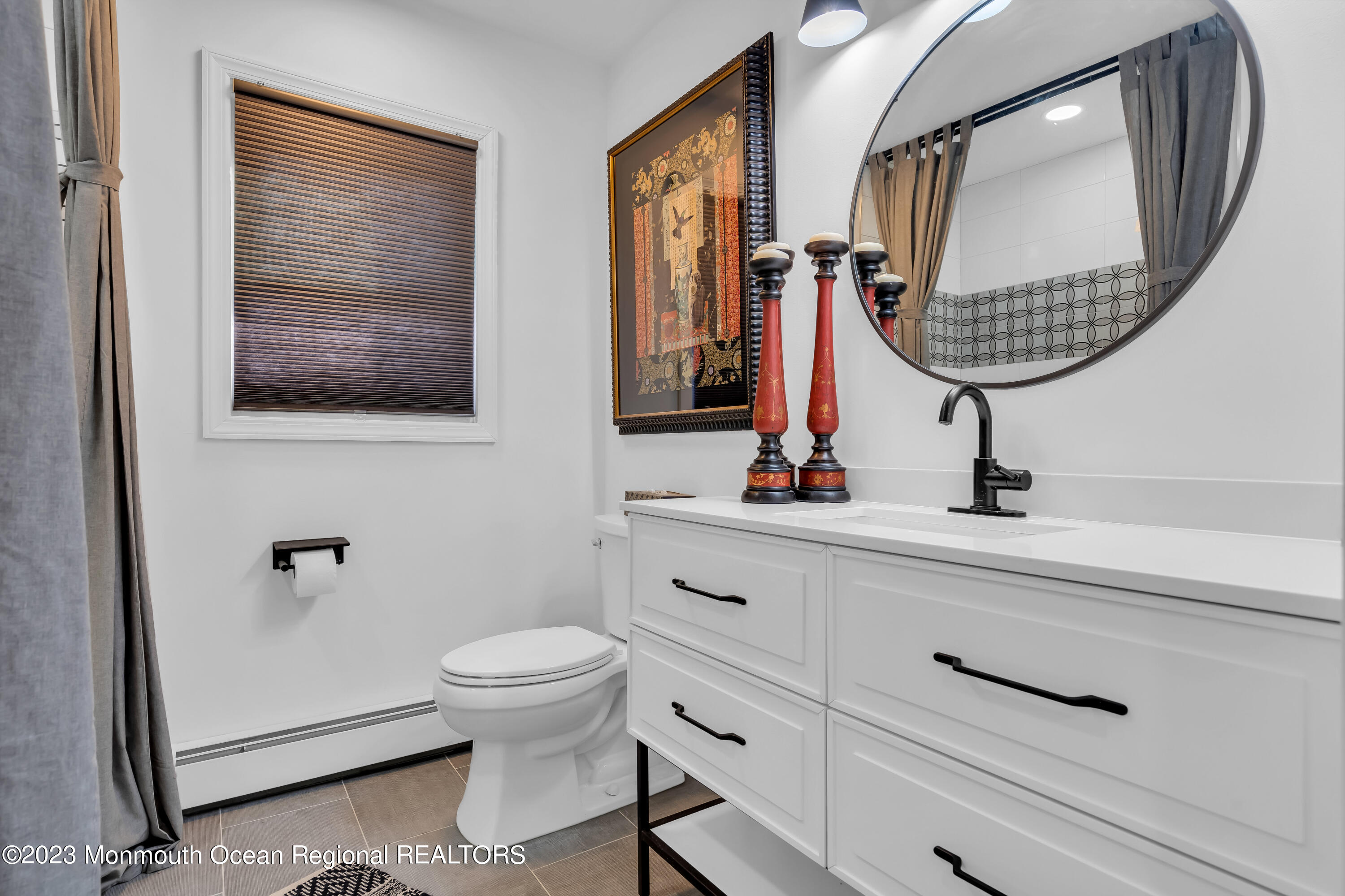 11 Garrett Road Toms River, NJ 08757 - Photo 42 of 61 a bathroom with a toilet a sink and mirror