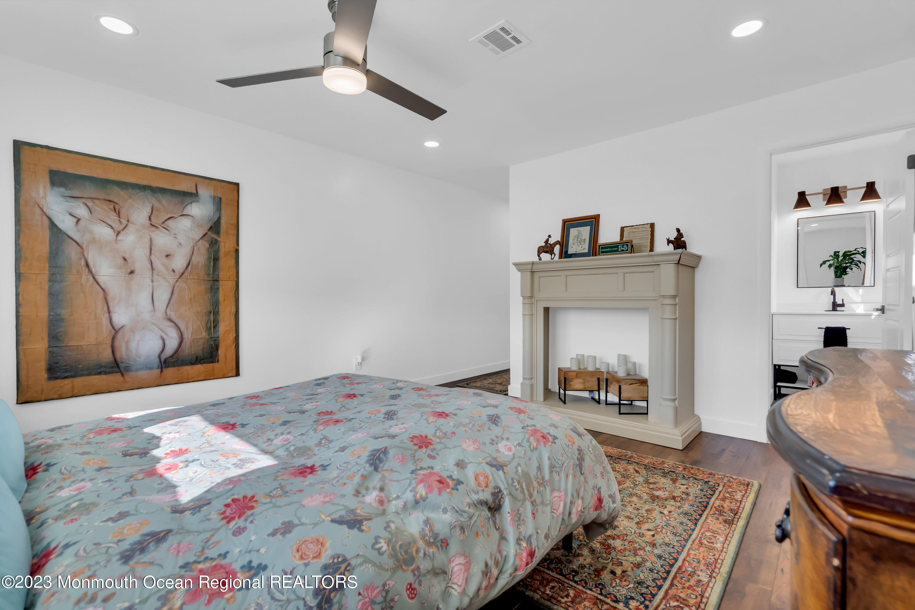 11 Garrett Road Toms River, NJ 08757 - Photo 48 of 61 a bedroom with a bed and a fireplace