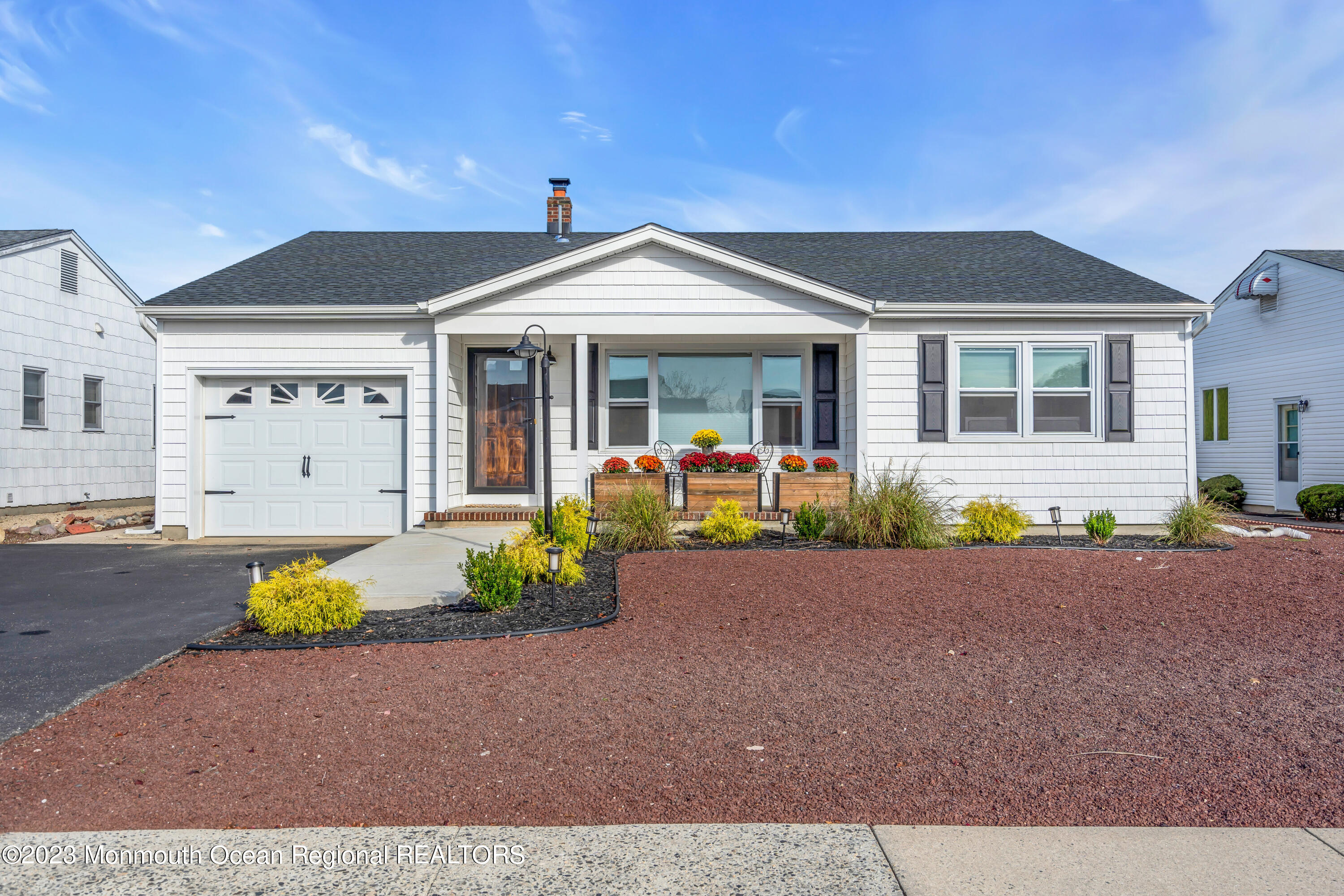 11 Garrett Road Toms River, NJ 08757 - Photo 7 of 61 a front view of a house with potted plants