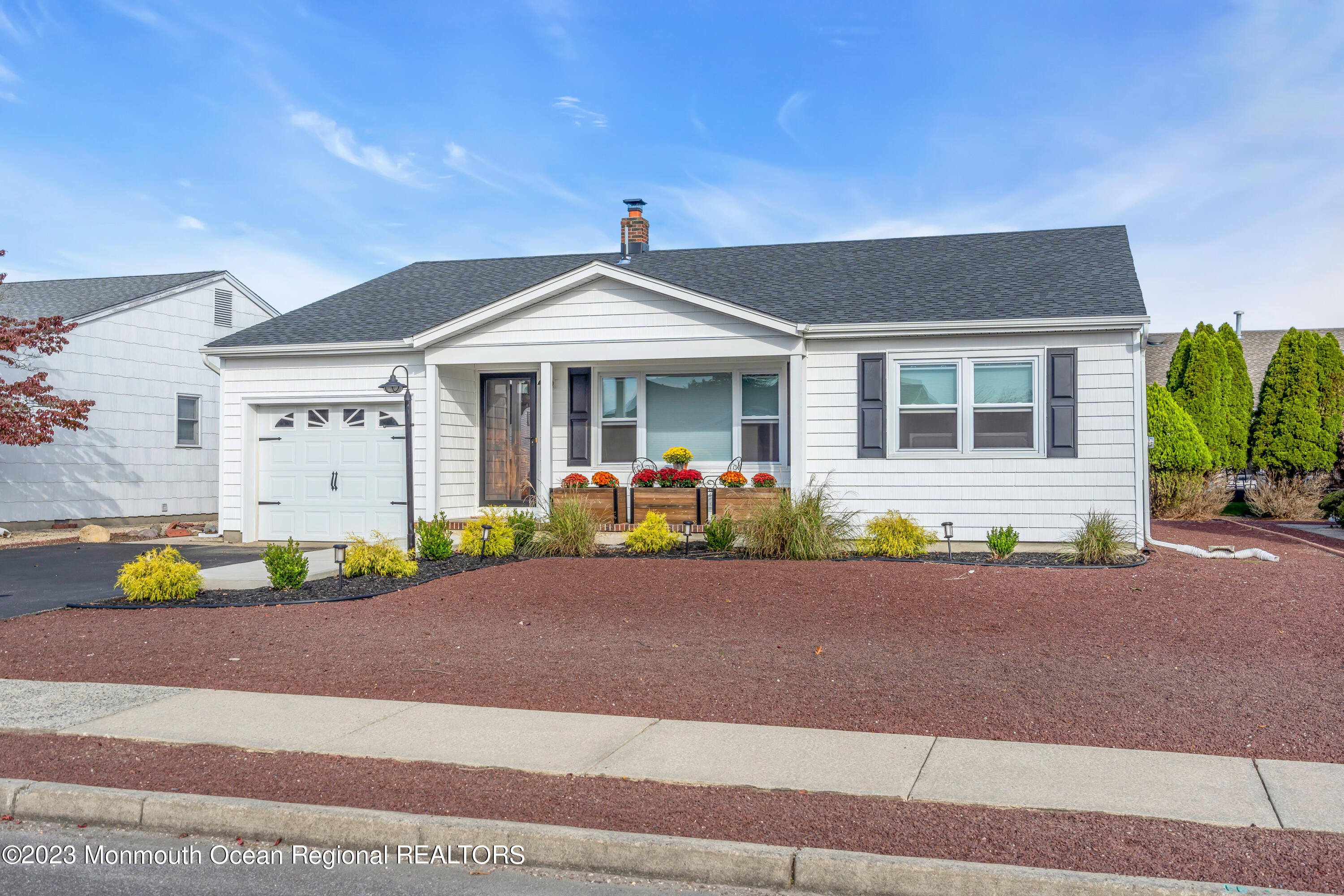 11 Garrett Road Toms River, NJ 08757 - Photo 8 of 61 a front view of a house with a garden