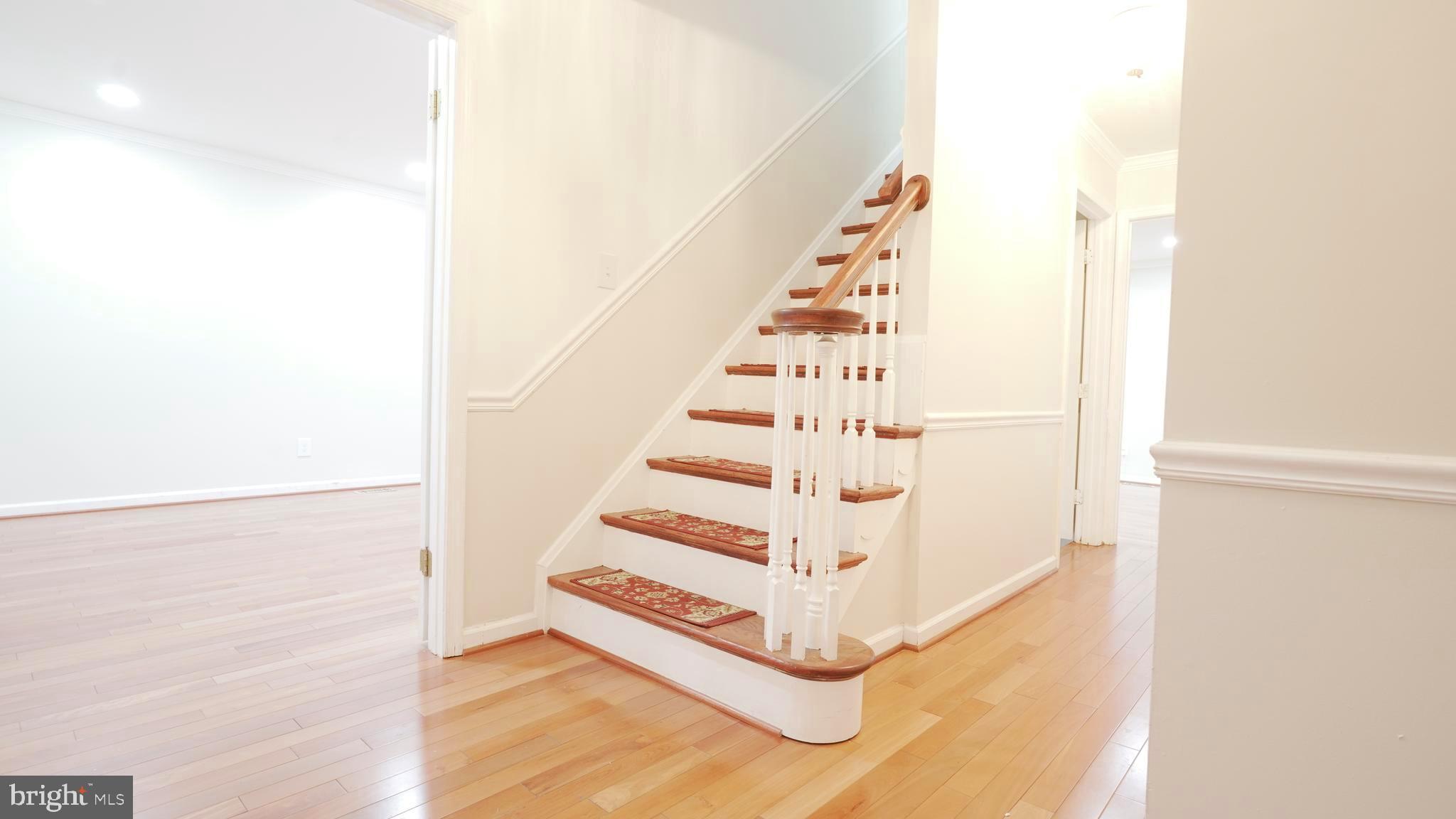 10203 Raleigh Tavern Lane Ellicott City, MD 21042 - Photo 25 of 57 a view of staircase with white walls