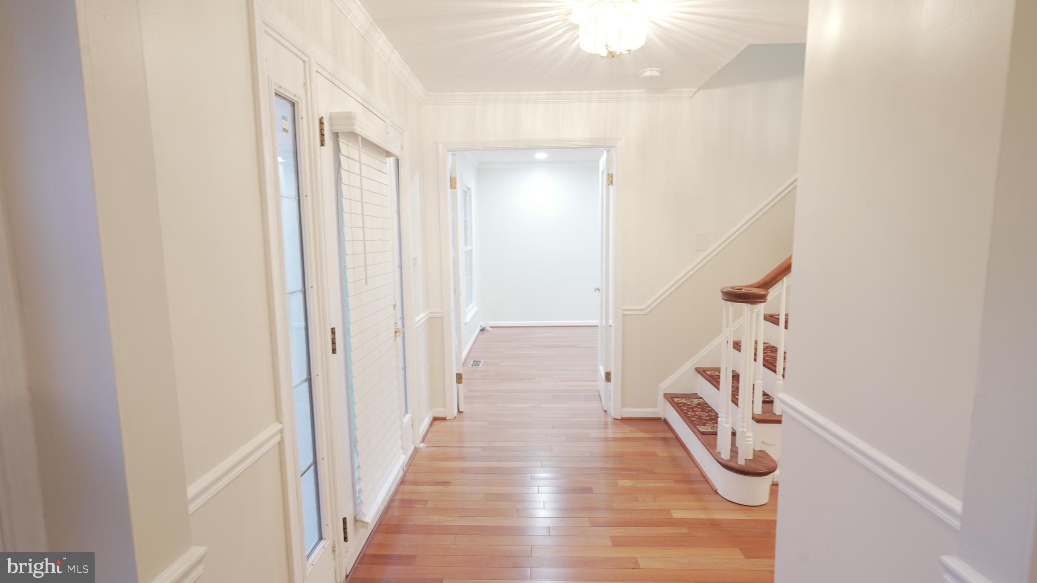 10203 Raleigh Tavern Lane Ellicott City, MD 21042 - Photo 4 of 57 a view of a livingroom with a white painted wall