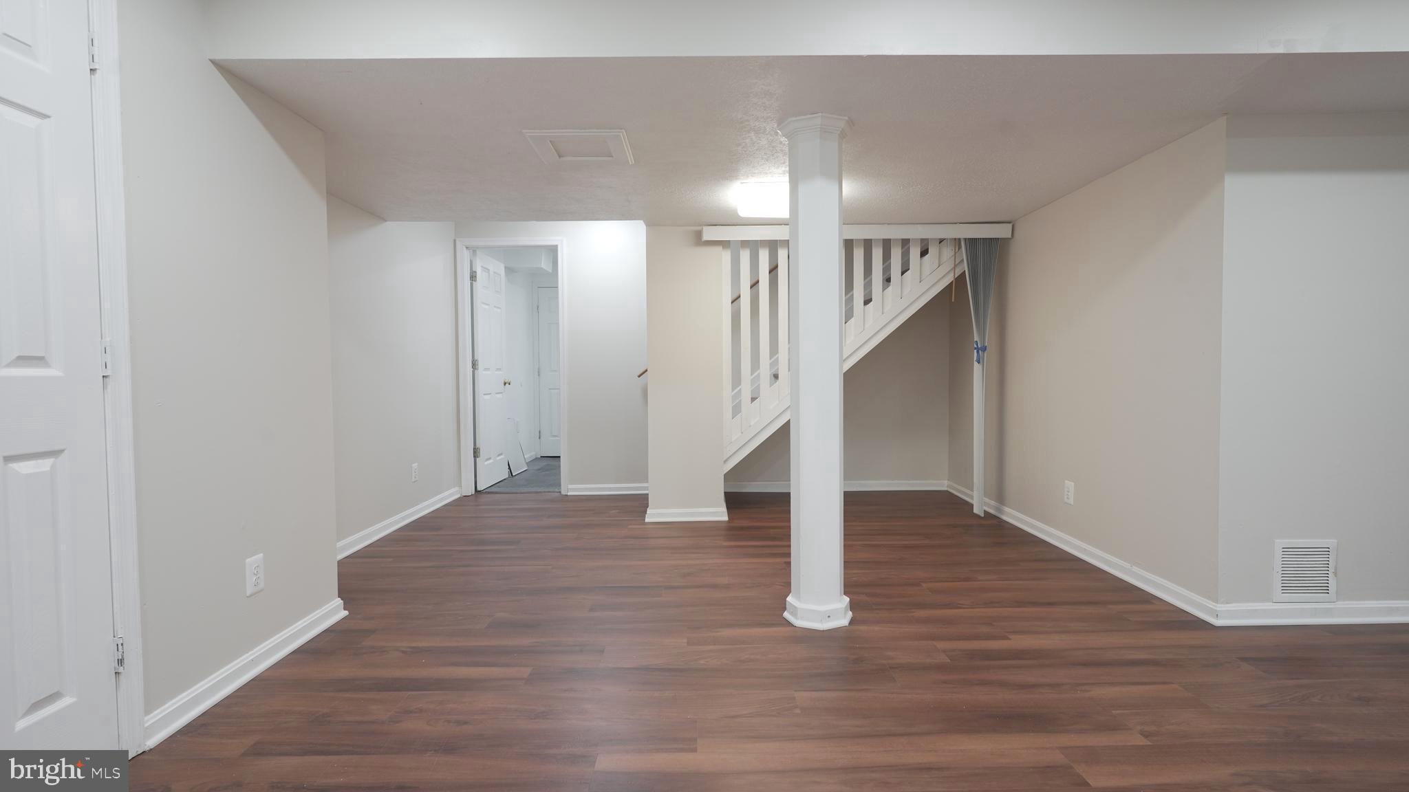 10203 Raleigh Tavern Lane Ellicott City, MD 21042 - Photo 42 of 57 a view of entryway and hall with wooden floor