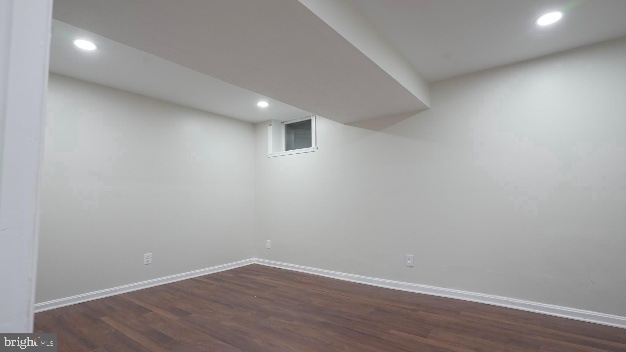 10203 Raleigh Tavern Lane Ellicott City, MD 21042 - Photo 46 of 57 a view of an empty room with wooden floor