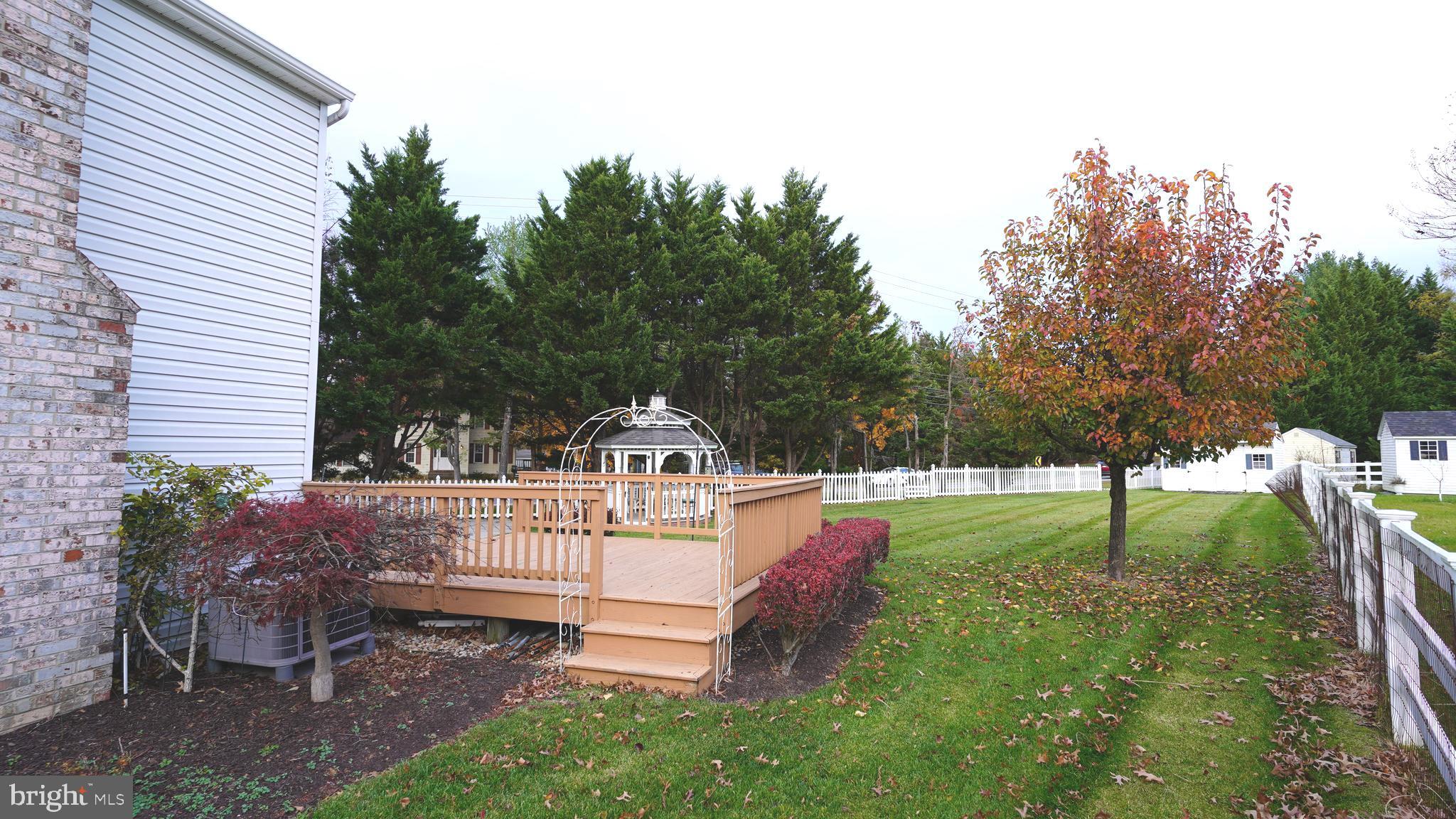 10203 Raleigh Tavern Lane Ellicott City, MD 21042 - Photo 52 of 57 a view of a house with a backyard and a slide