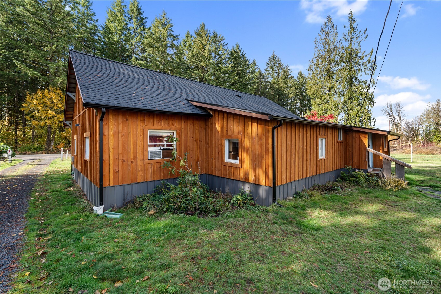 565 Meier Road Winlock, WA 98596 - Photo 16 of 26 a view of a backyard with potted plants and large tree