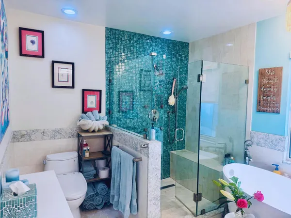 a bathroom with a sink toilet and shower