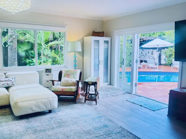 a living room with furniture and a garden
