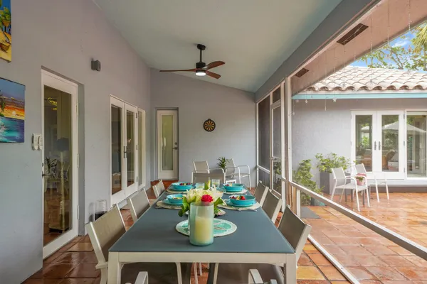 a dining room with furniture and window