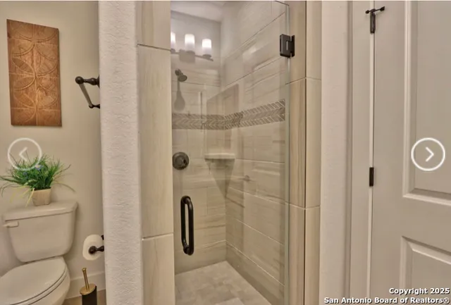 a bedroom with a bed a window and dresser