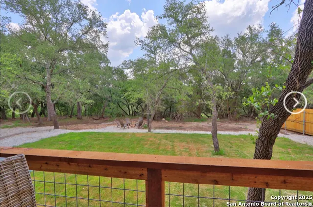 a view of swimming pool with a tree