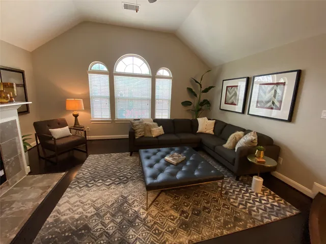 a living room with furniture and a large window