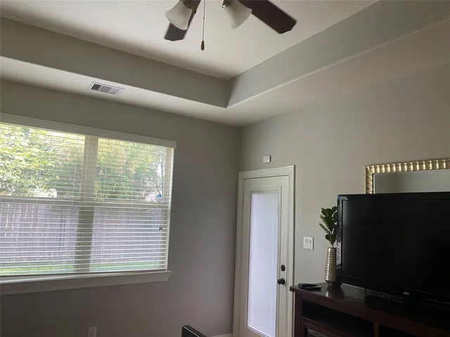 a view of a livingroom with furniture and a window