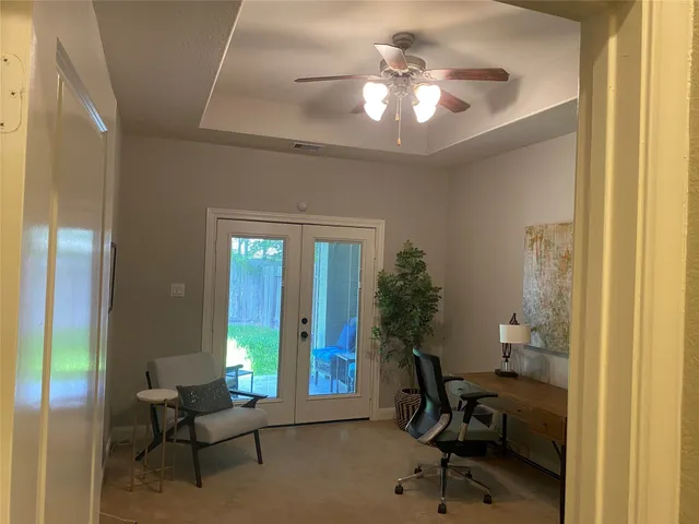 a view of a room that has a bed and a window