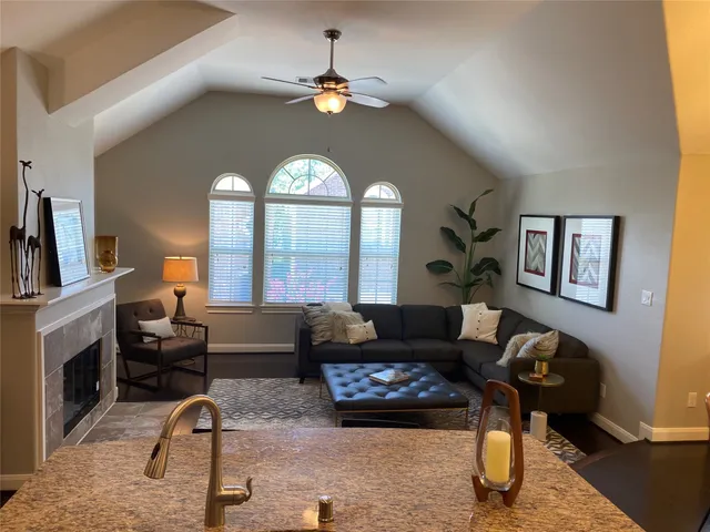 a living room with furniture and a large window