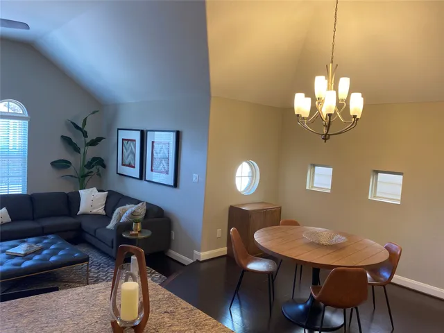 a living room with furniture a window and a table