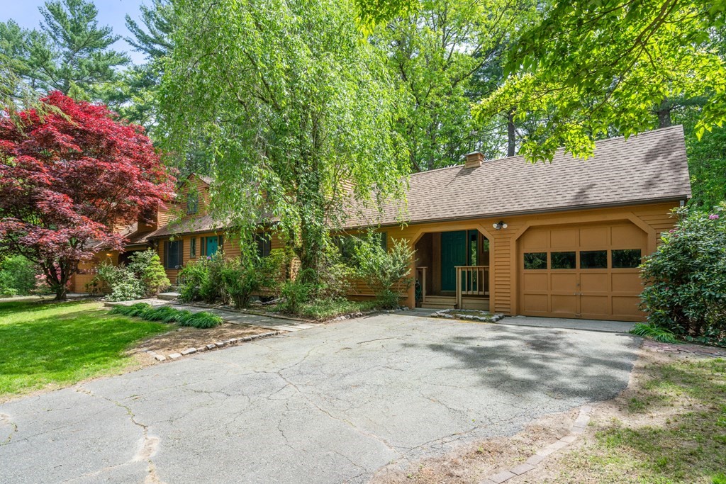 24 Granison Road Weston, MA 02493 - Photo 2 of 30 a front view of a house with a garden