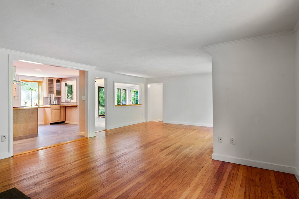 24 Granison Road Weston, MA 02493 - Photo 3 of 30 an empty room with wooden floor and windows