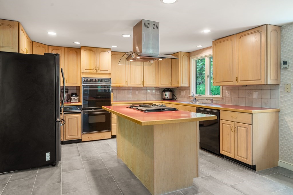 24 Granison Road Weston, MA 02493 - Photo 6 of 30 a kitchen with a sink stove and refrigerator