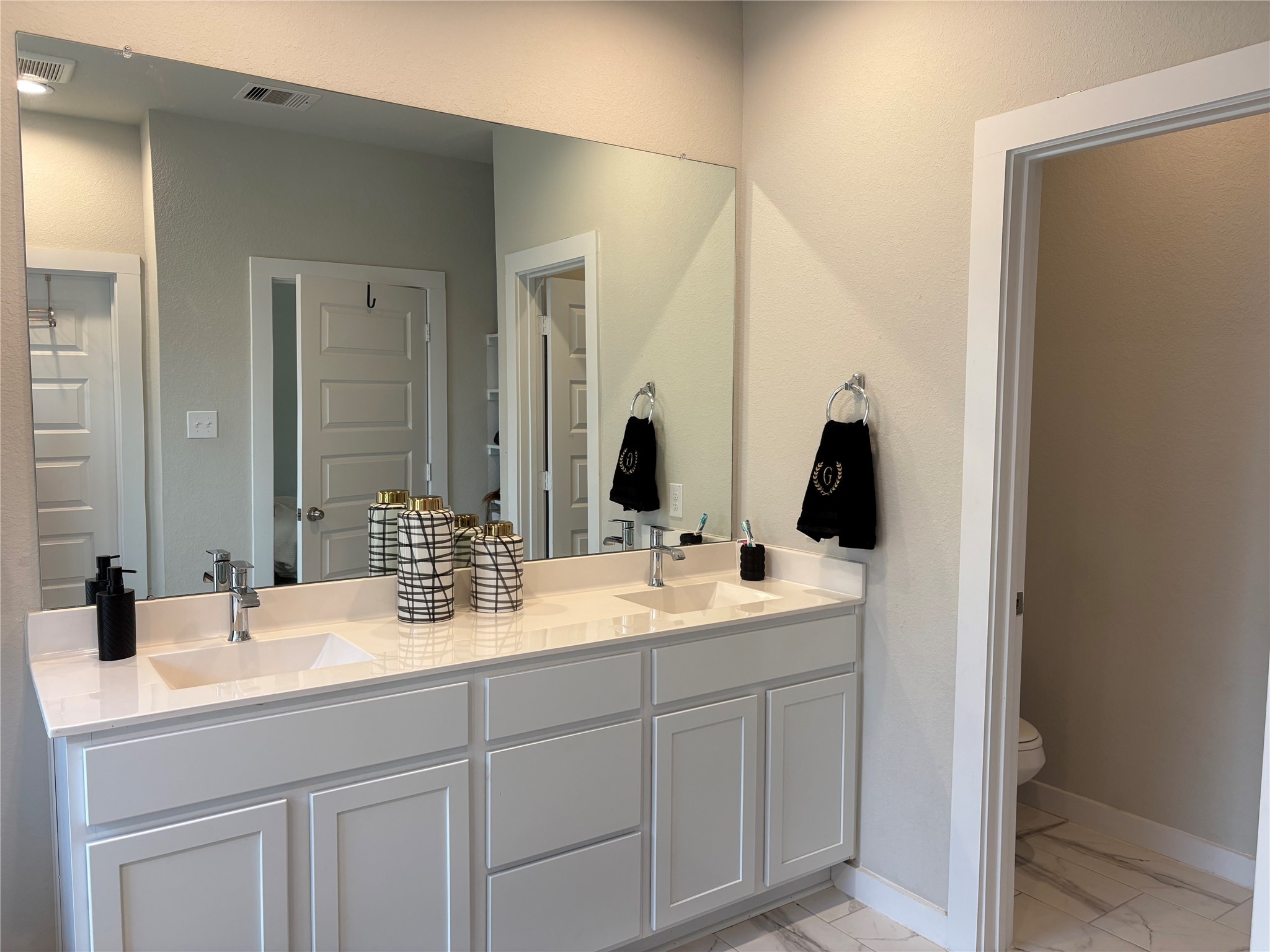 2142 Reed Cave Lane Spring, TX 77386 - Photo 13 of 15 a bathroom with a double vanity sink and mirror