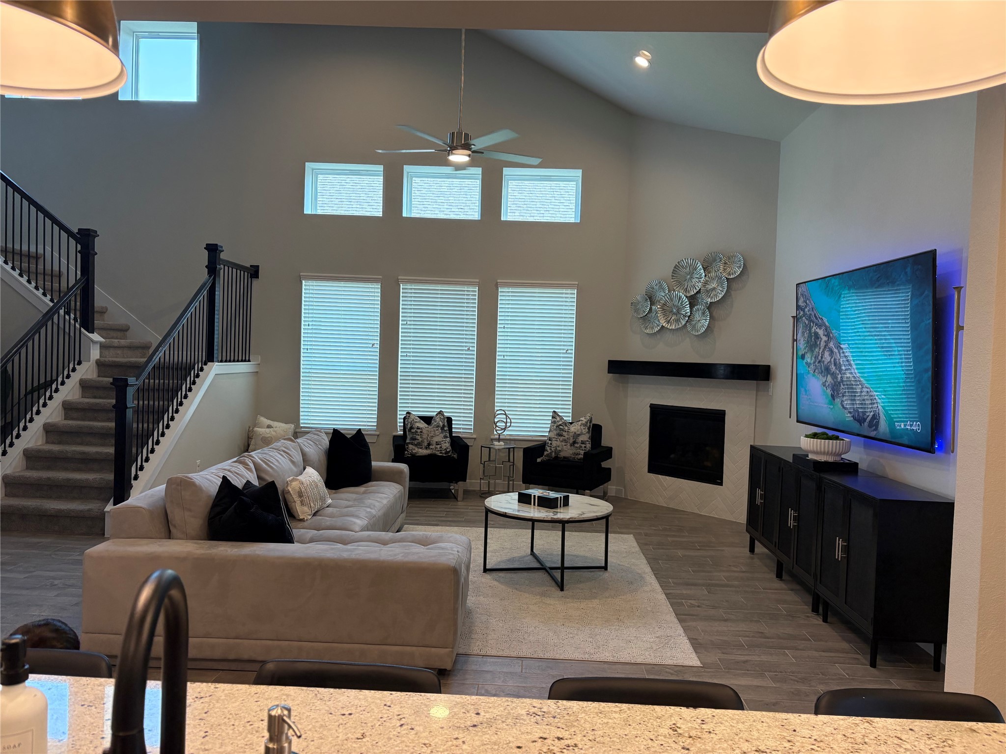 2142 Reed Cave Lane Spring, TX 77386 - Photo 2 of 15 a living room with furniture a fireplace and a flat screen tv