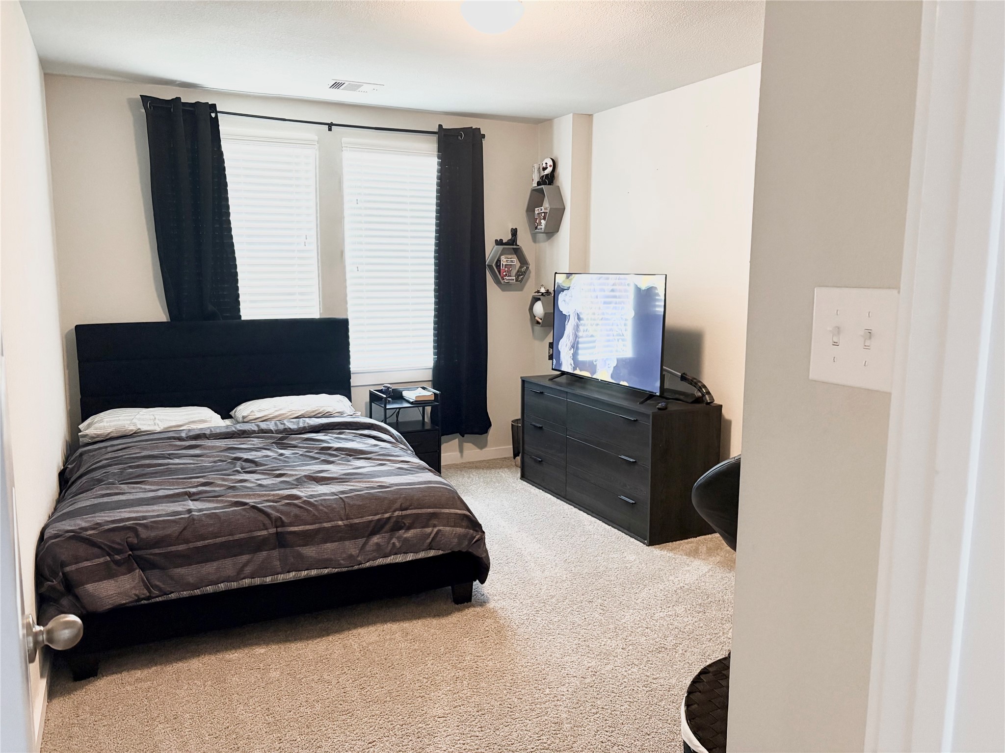 2142 Reed Cave Lane Spring, TX 77386 - Photo 5 of 15 a bedroom with a bed and wooden floor