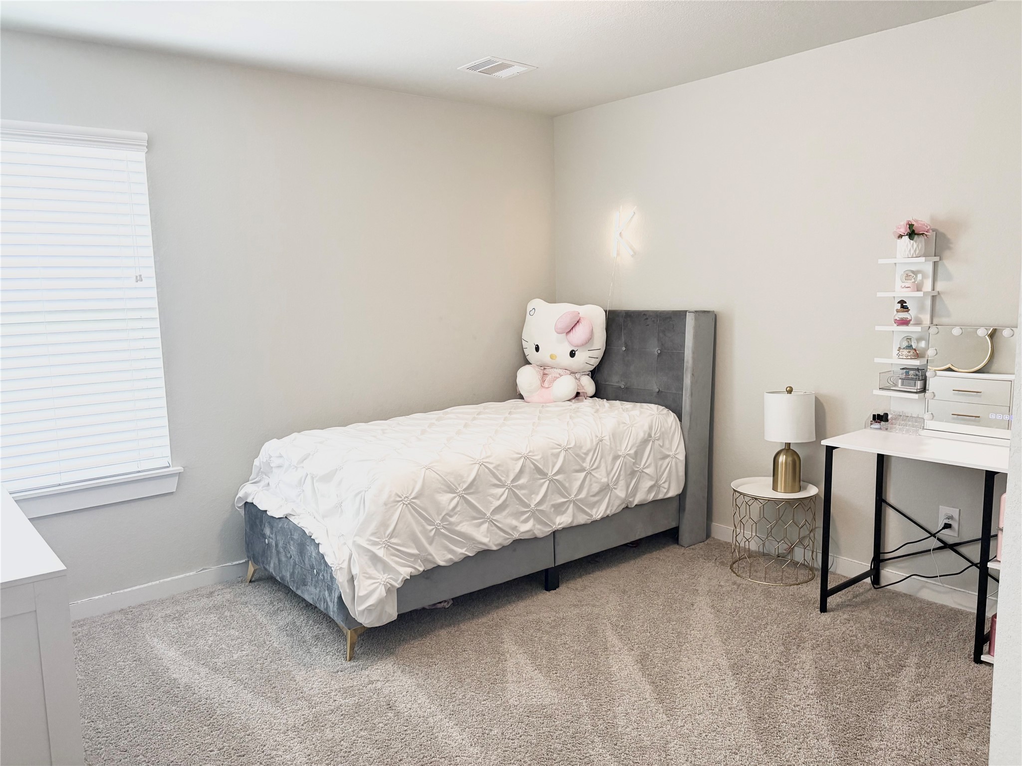 2142 Reed Cave Lane Spring, TX 77386 - Photo 6 of 15 a bedroom with a bed table chair and a window