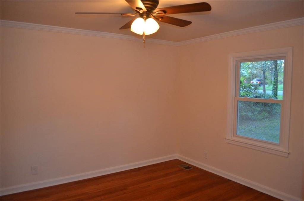 1329 Westridge Road Southwest Atlanta, GA 30311 - Photo 37 of 54 an empty room with a window